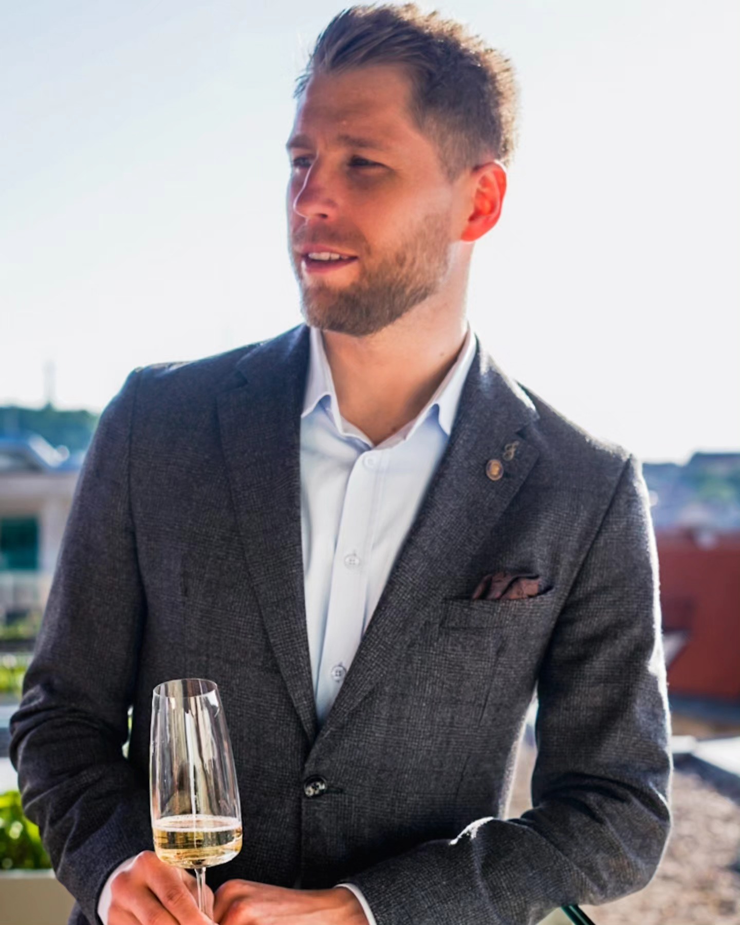 Guest portrait with champagne at a rooftop event
